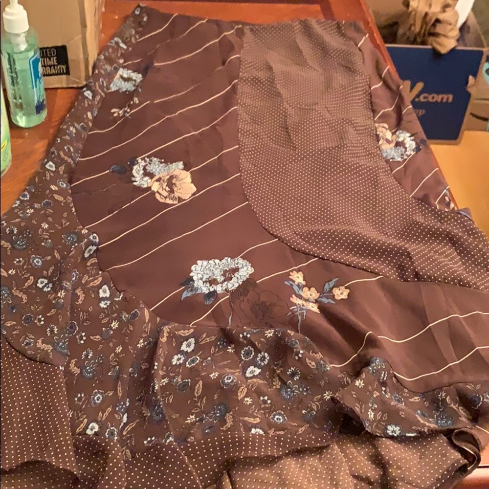 Size 6  skirt. Below knee. Lined sheer top layer.